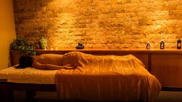 Guests can enjoy a soothing massage on a comfortable table in this serene space.