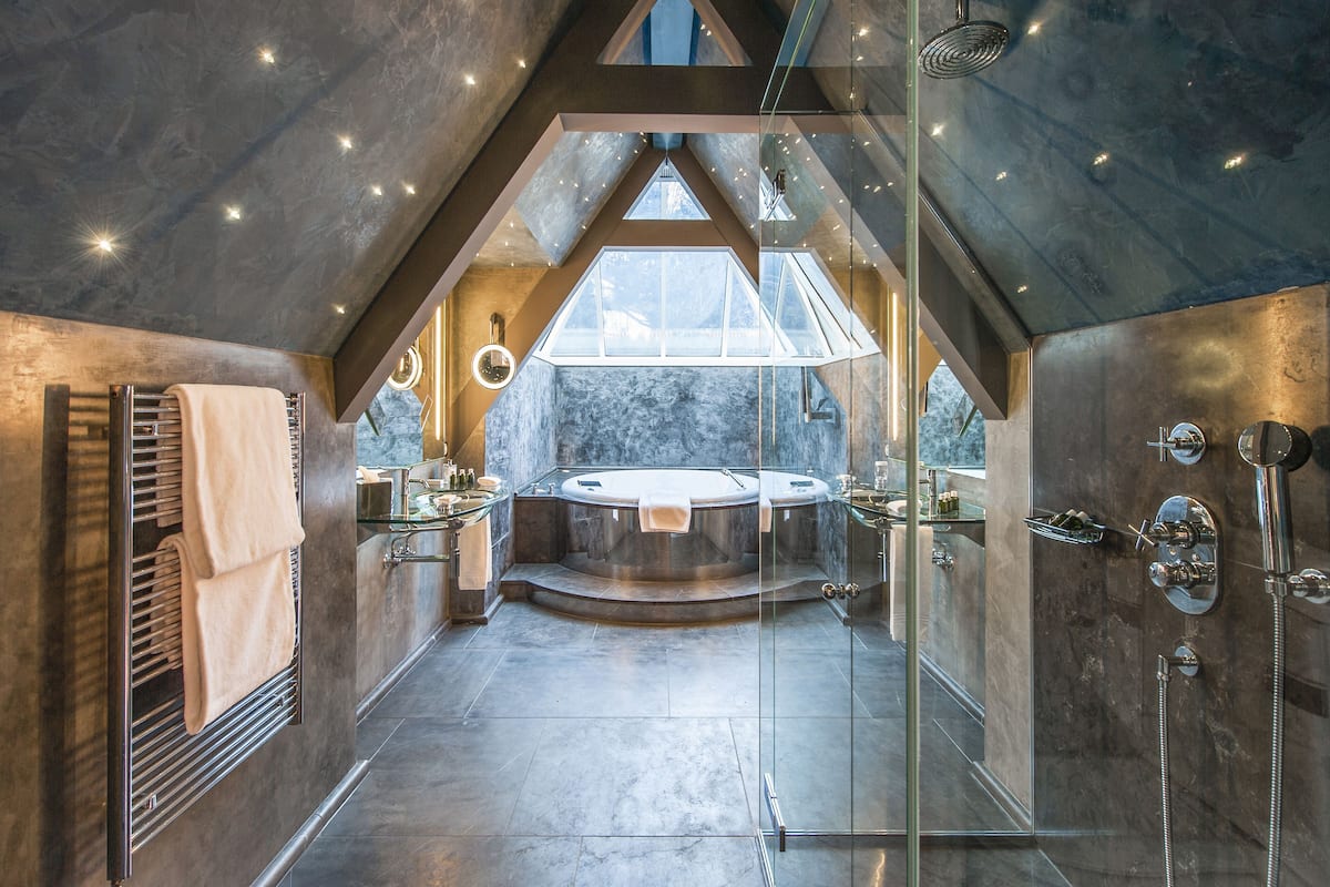 designer toiletries, hair dryer, bathrobes, slippers