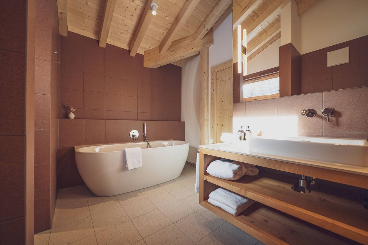 junior suite | bathroom | deep-soaking bathtub, free toiletries, hair dryer, bathrobes