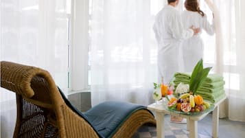 Relax in a serene space with a comfortable seating area and refreshments at hand.