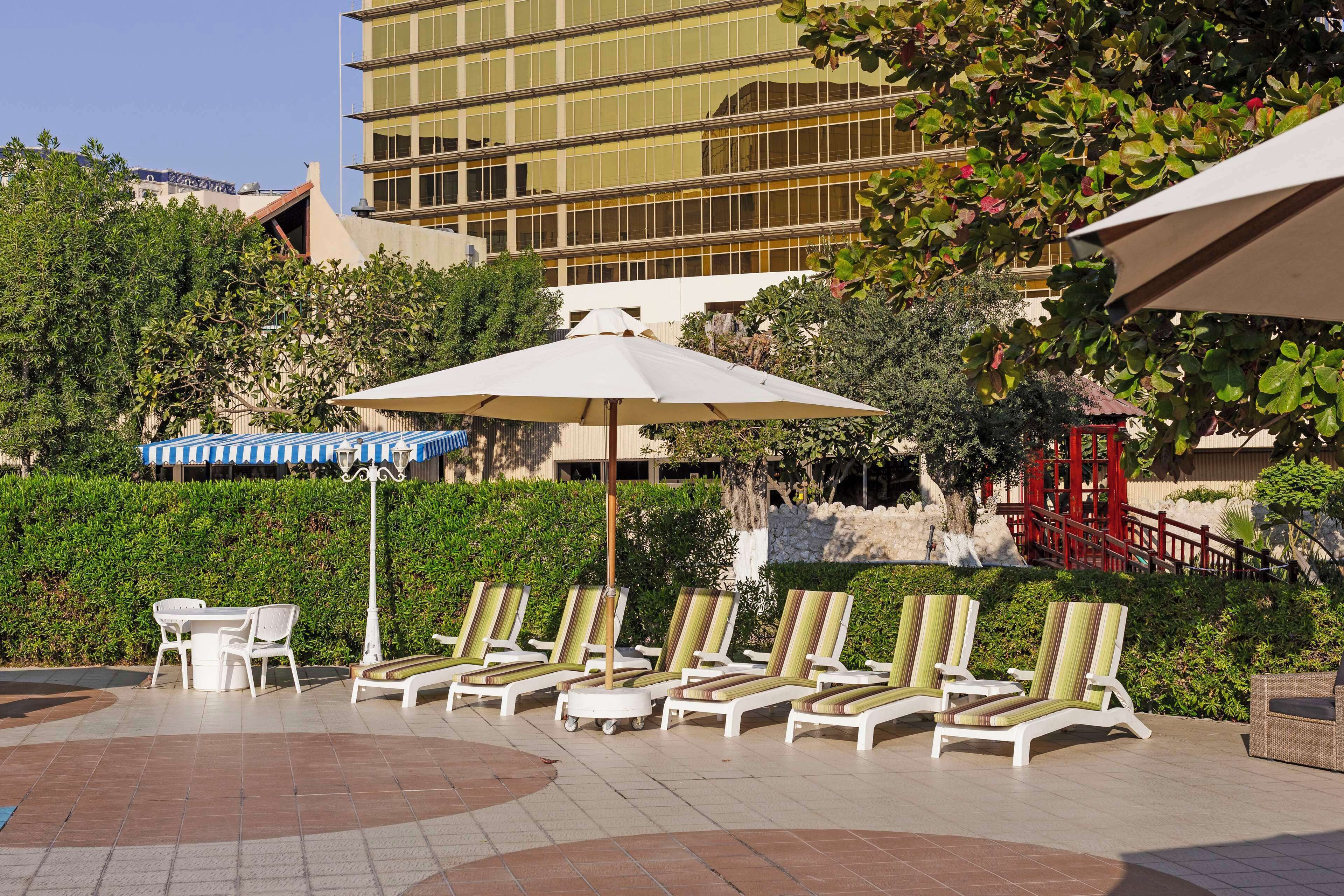 outdoor pool, pool umbrellas, pool loungers