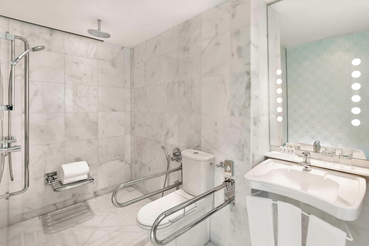 deluxe room, 1 king bed, non smoking, sea view | bathroom | free toiletries, hair dryer, bathrobes, slippers