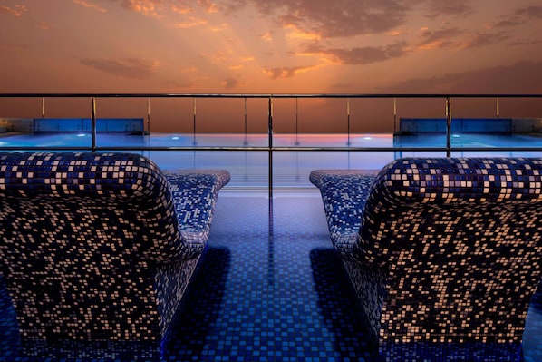 5 outdoor pools, open 5:30 AM to 10:00 PM, pool umbrellas, sun loungers