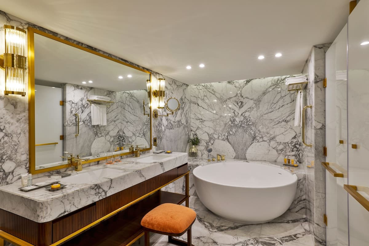 designer toiletries, hair dryer, bathrobes, slippers