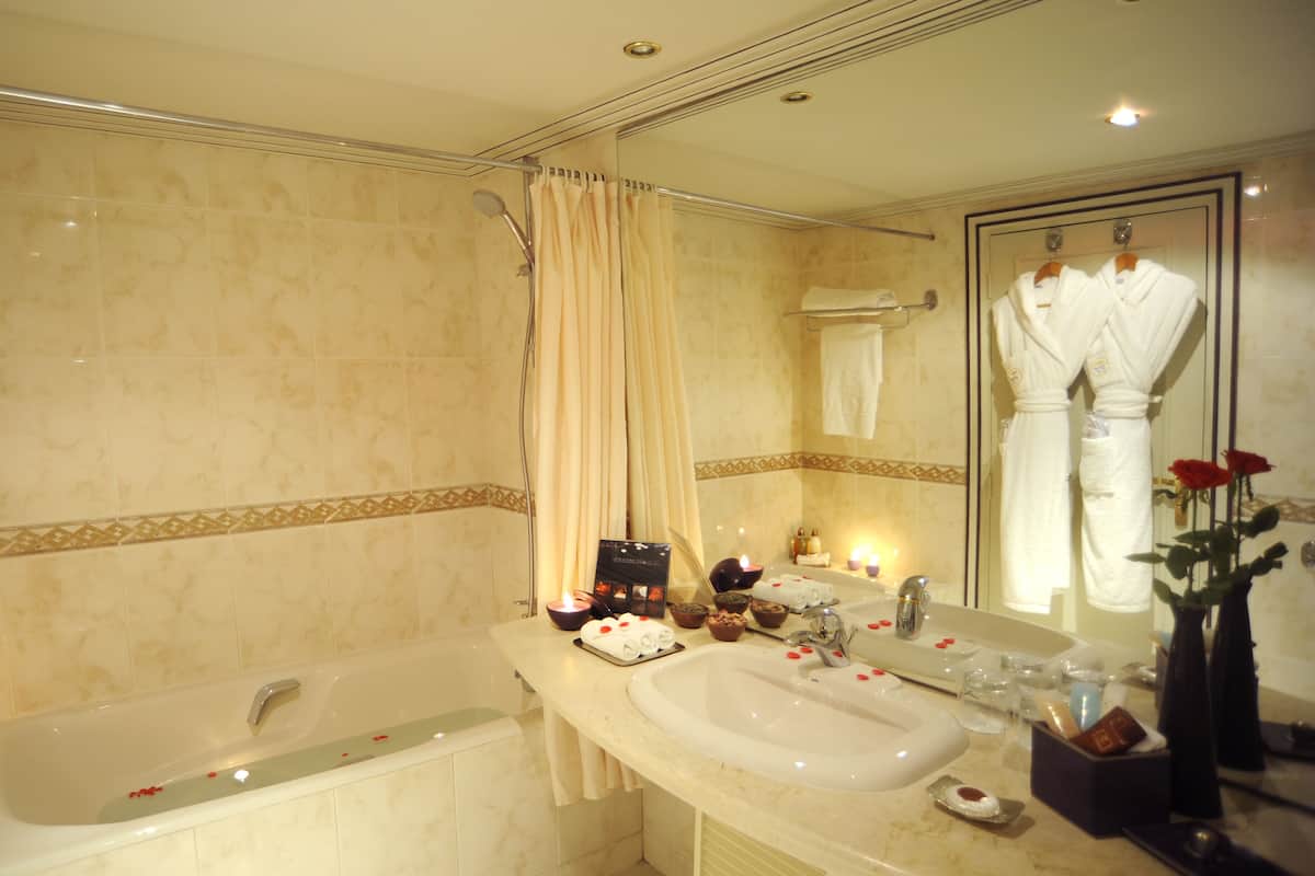 bathtub, free toiletries, hair dryer, bathrobes