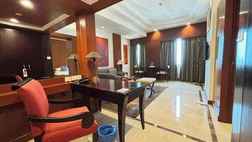 Suite | In-room safe, desk, laptop workspace, iron/ironing board