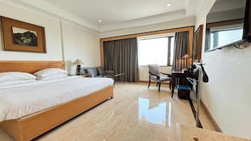 Deluxe Room | In-room safe, desk, laptop workspace, iron/ironing board