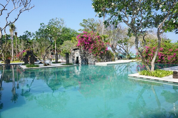 3 outdoor pools, open 8 AM to 7 PM, pool umbrellas, pool loungers