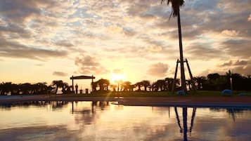 Seasonal outdoor pool, open 9:00 AM to 6:00 PM, pool umbrellas