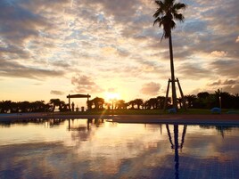 Seasonal outdoor pool, open 9:00 AM to 6:00 PM, pool umbrellas