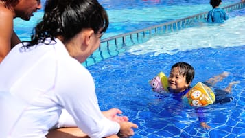 Seasonal outdoor pool, open 9:00 AM to 6:00 PM, pool umbrellas