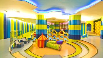 A vibrant play area with colorful structures and a curved floor design.