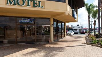 A motel with a reception area and a bakery.
