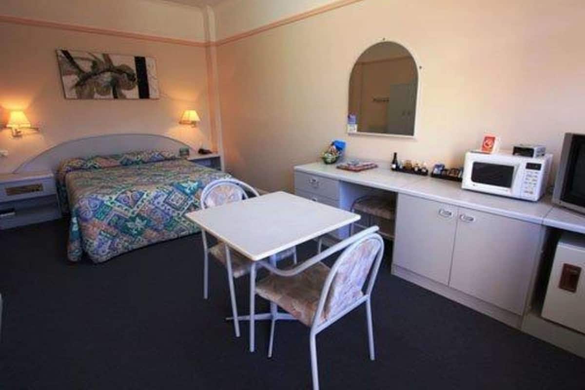 Minibar, desk, laptop workspace, iron/ironing board