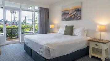 Standard Room, 1 King Bed, Pool View | In-room safe, desk, laptop workspace, blackout drapes