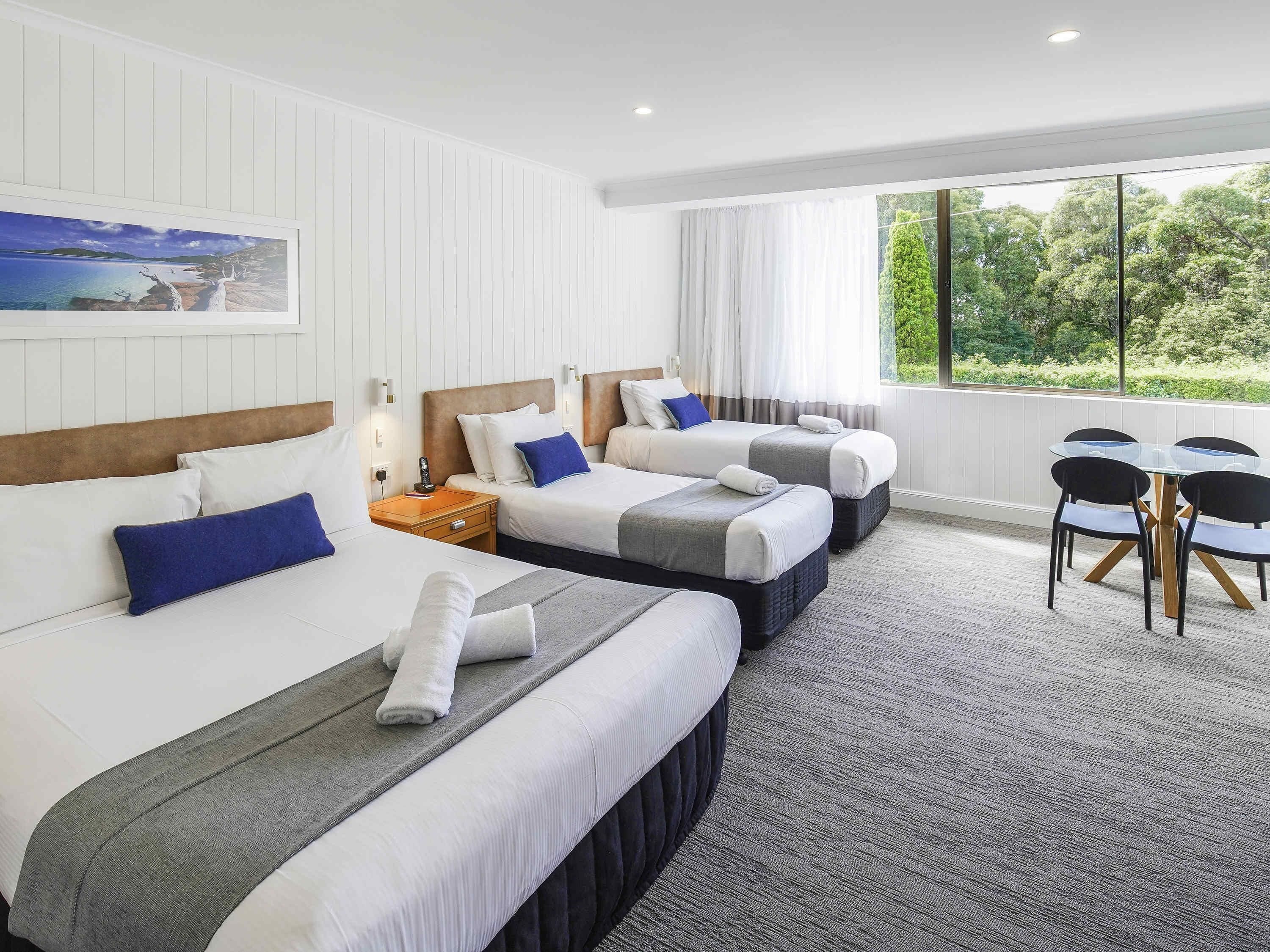 standard room, multiple beds | premium bedding, minibar, desk, blackout curtains