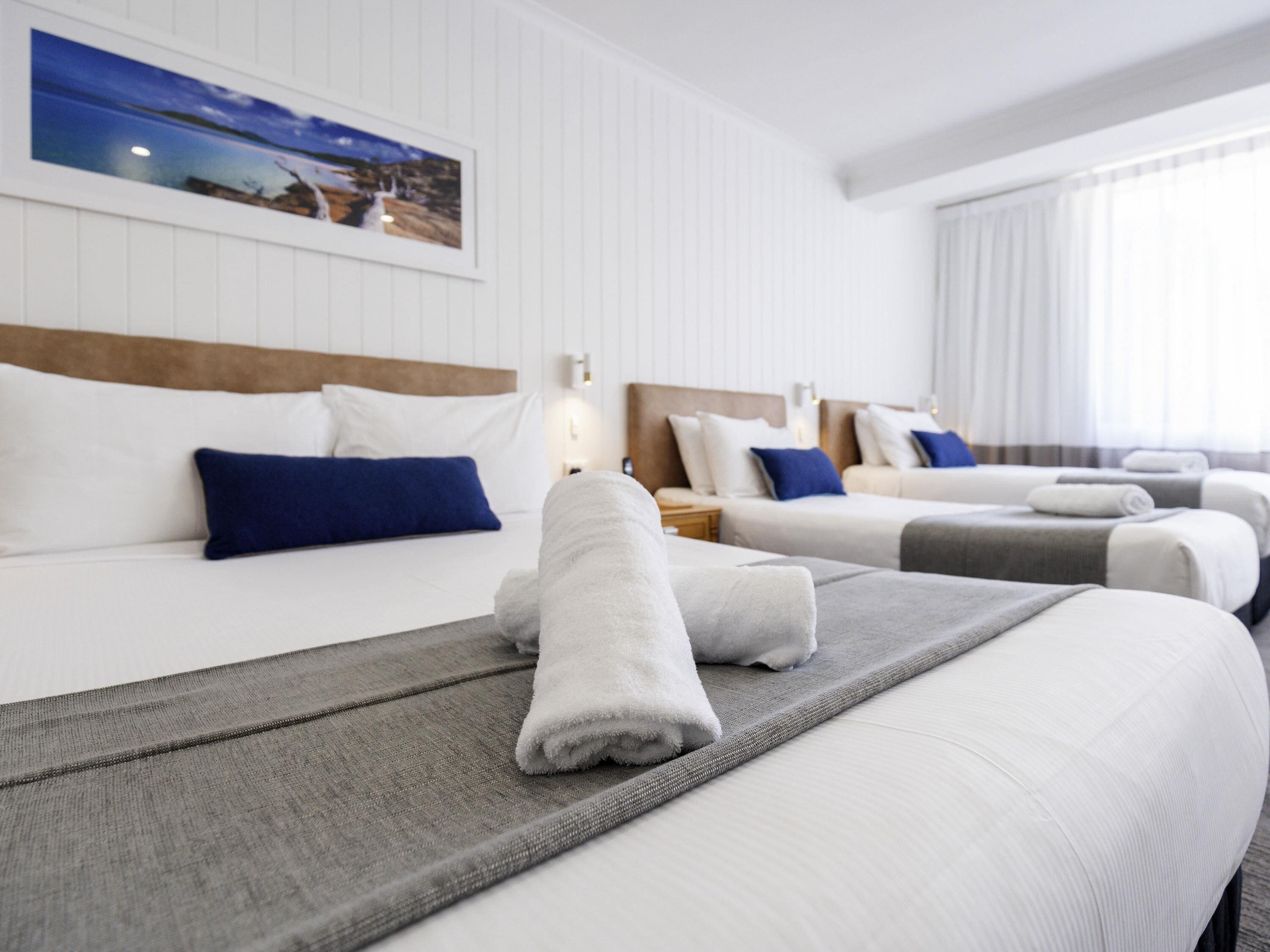 standard room, multiple beds | premium bedding, minibar, desk, blackout curtains