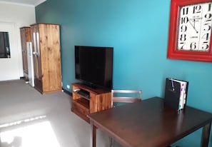 Room 18: Queen Supreme Room with 50 inch Smart TV located on First Floor | 1 bedroom, iron/ironing board, free WiFi, bed sheets