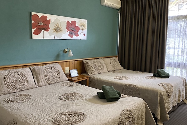 Room 11: Standard Two Queens with 50 inch Smart TV located on Ground Floor | Iron/ironing board, WiFi (free), bed sheets