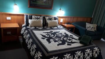 Room 4: Queen Standard Room with 50 inch Smart TV located on Ground Floor