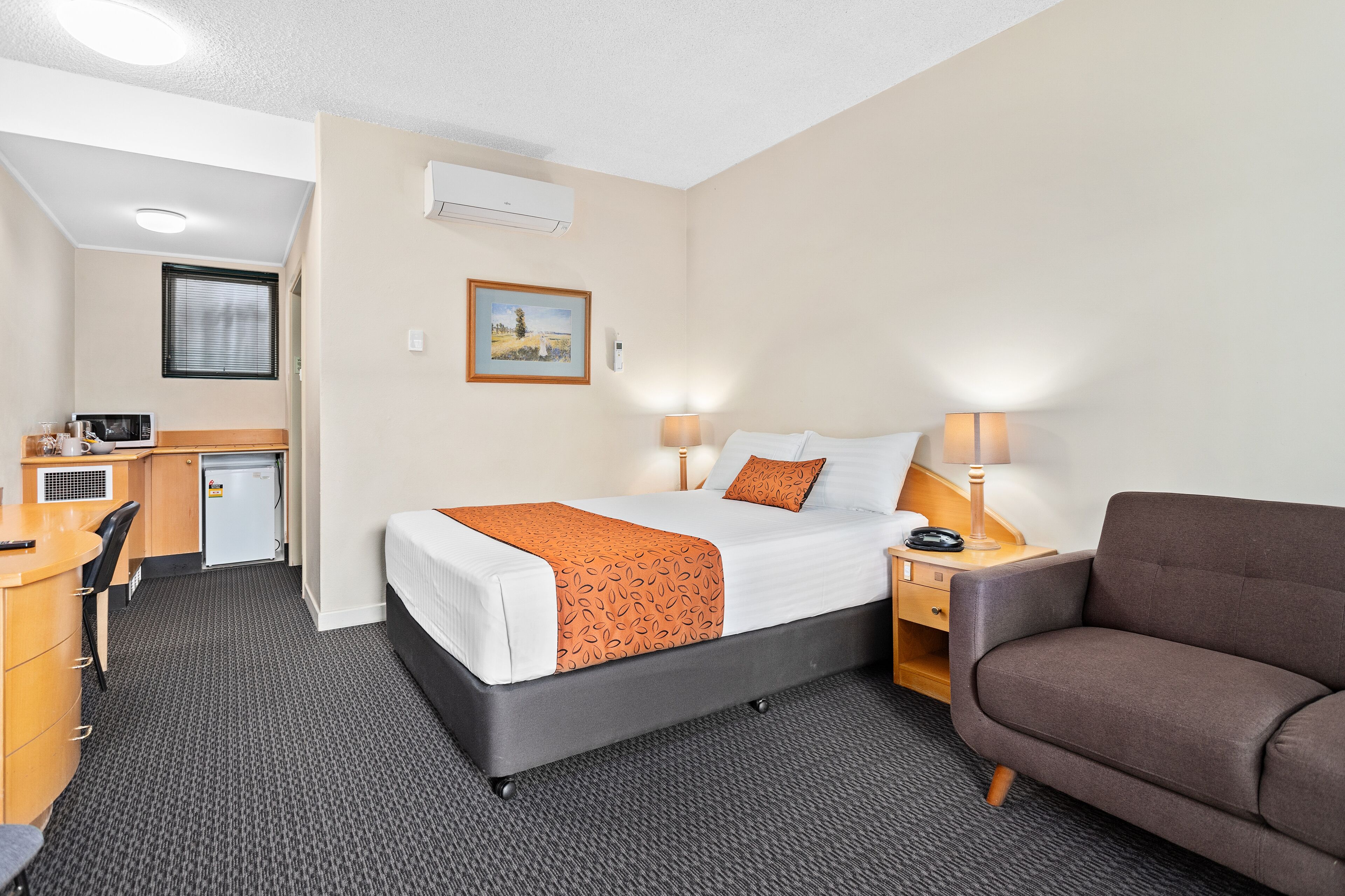 Premium bedding, pillow-top beds, desk, laptop workspace