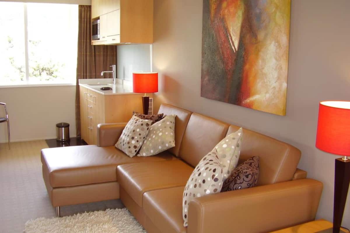 executive suite with balcony | living area | lcd tv