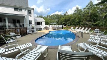Seasonal outdoor pool, open 9:00 AM to 9:00 PM, pool loungers