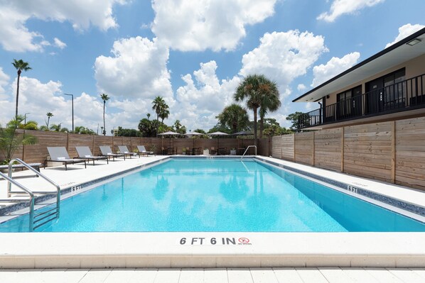 Outdoor pool, pool umbrellas, sun loungers
