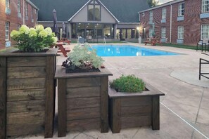 Seasonal outdoor pool, open 9:00 AM to 9:00 PM, pool umbrellas