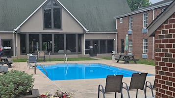 Seasonal outdoor pool, open 9:00 AM to 9:00 PM, pool umbrellas