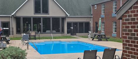 Seasonal outdoor pool, open 9:00 AM to 9:00 PM, pool umbrellas