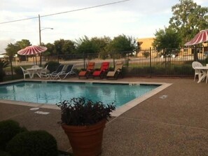 Outdoor pool, open 9 AM to midnight, pool loungers