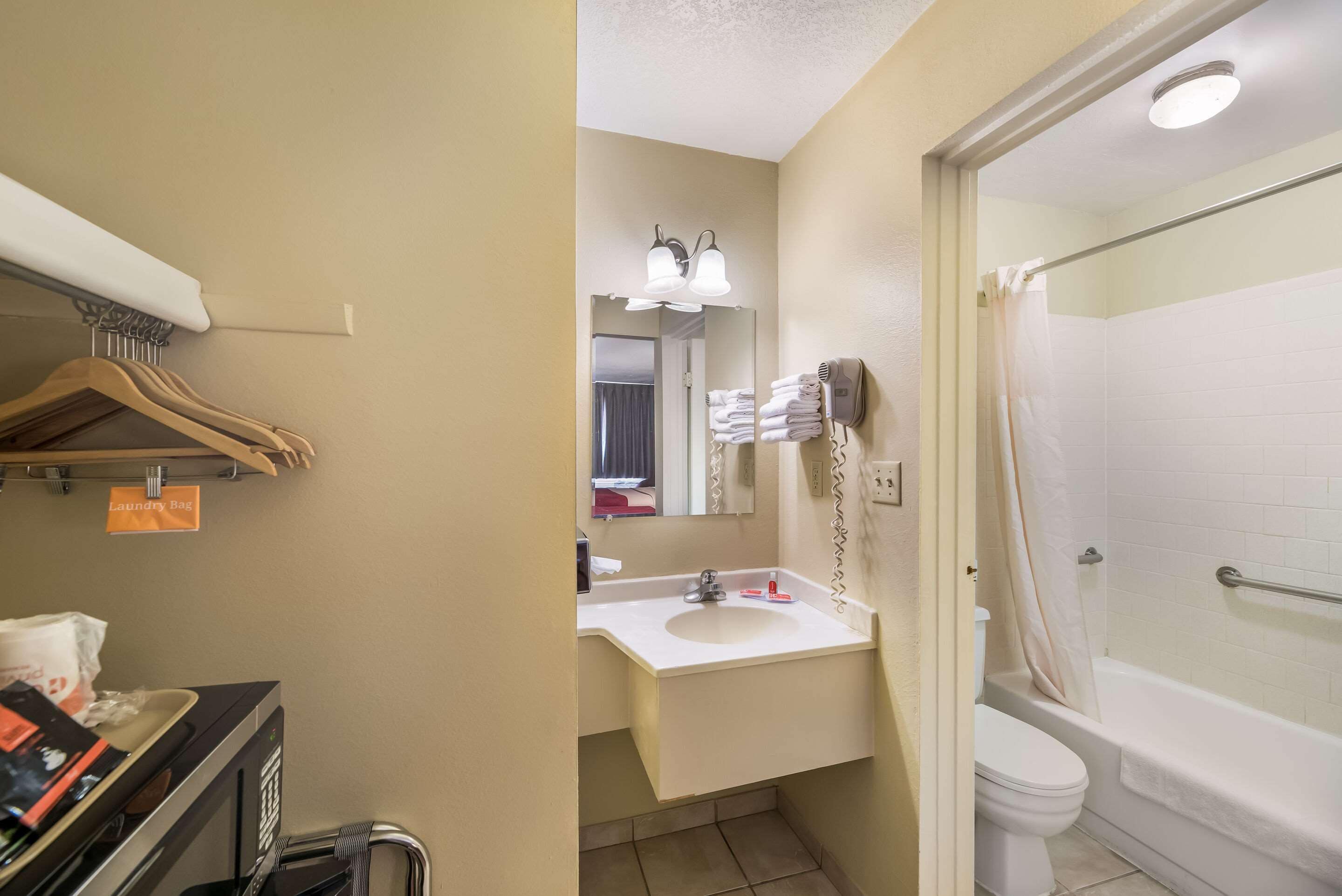 Standard Room, 2 Queen Beds, Non Smoking | Bathroom | Combined shower/tub, hair dryer, towels