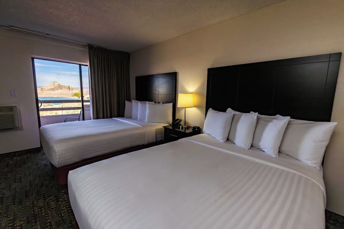 Deluxe View, Two Queen Beds, Non-Smoking | Desk, soundproofing, iron/ironing board, bed sheets