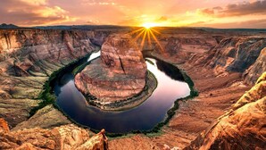 A canyon with a river winding through it. - Super 8 by Wyndham Williams West Route 66/Grand Canyon Area (Williams)