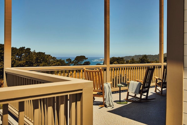 A balcony with a view of the ocean, a chair, a small table, and a book. - Hill House at Trailborn Mendocino, Outdoor Collection by Marriott Bonvoy (Mendocino)