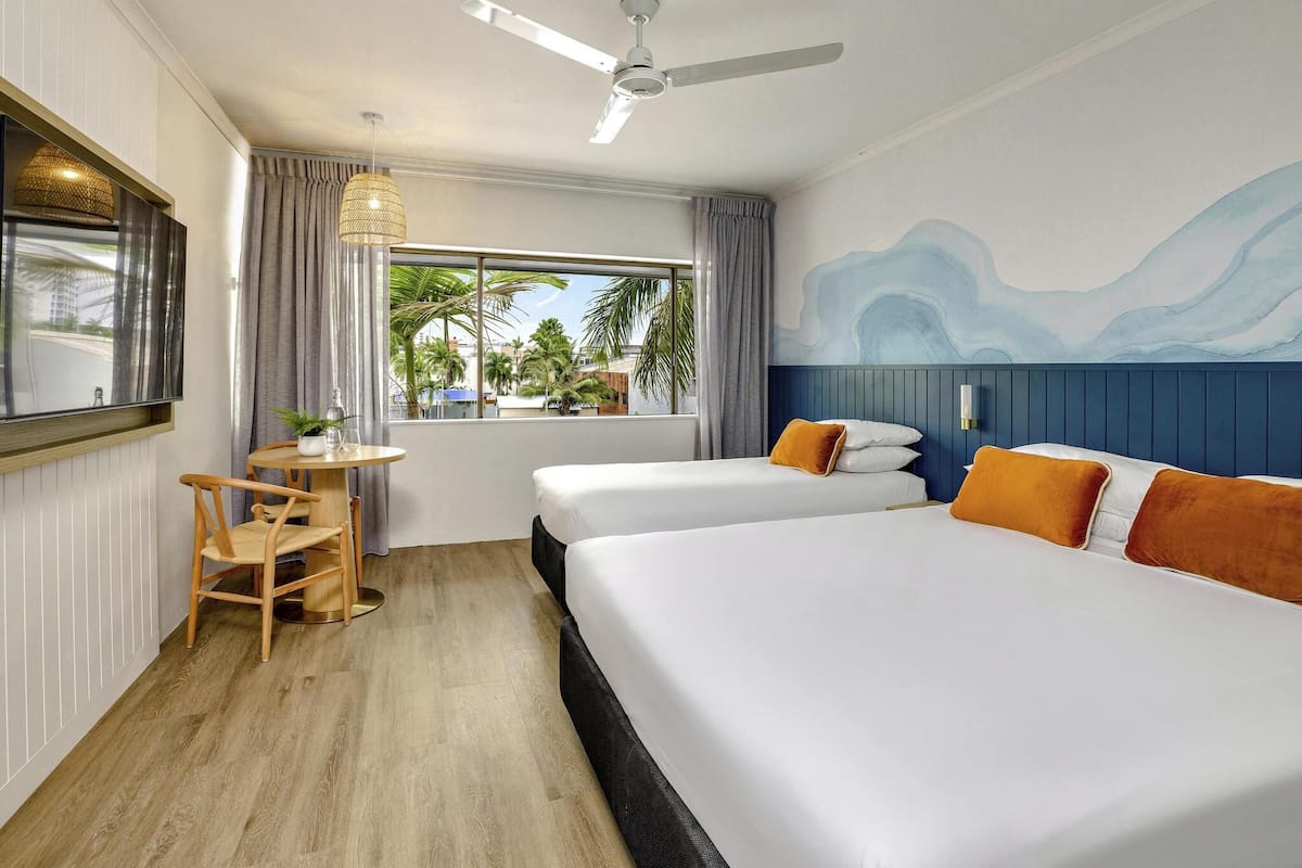 Standard Room, Multiple Beds | Minibar, desk, laptop workspace, iron/ironing board