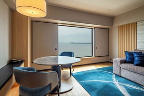 Deluxe Suite Ocean View | Living area | 1-inch flat-screen TV with digital channels, TV
