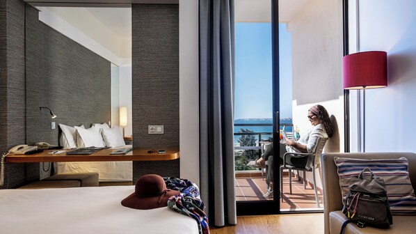 Deluxe Room, Partial Sea View | Minibar, in-room safe, blackout drapes, free cribs/infant beds