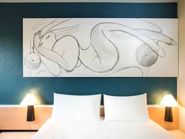 Premium bedding, desk, laptop workspace, iron/ironing board