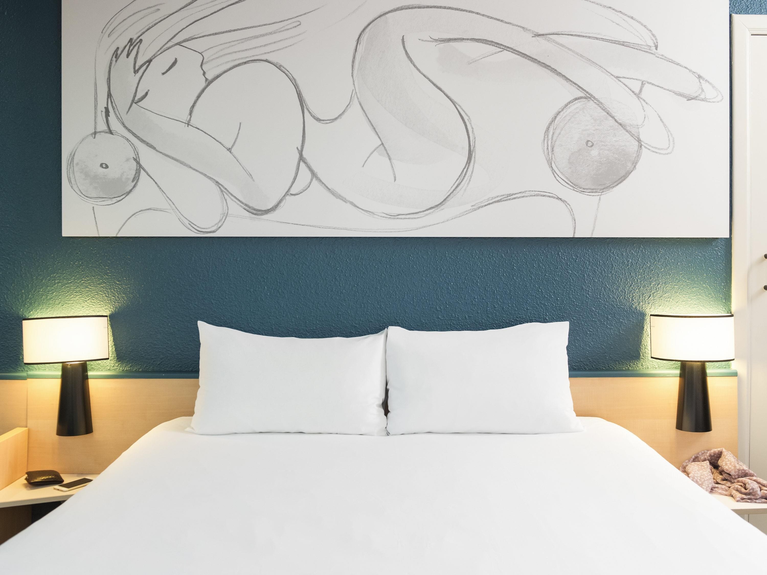 Premium bedding, desk, laptop workspace, iron/ironing board