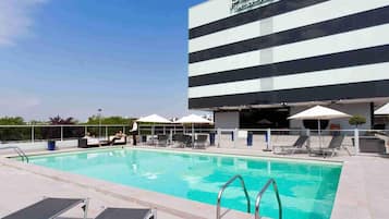 Seasonal outdoor pool, open 7:00 AM to 10:30 PM, sun loungers