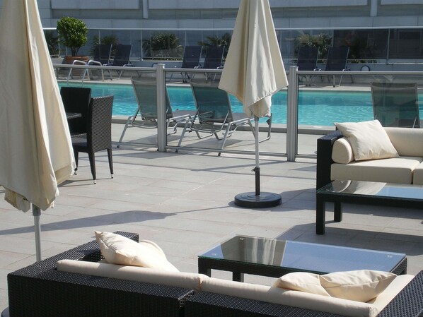 Seasonal outdoor pool, open 7:00 AM to 10:30 PM, sun loungers