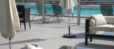 Seasonal outdoor pool, open 7:00 AM to 10:30 PM, sun loungers