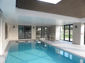 Indoor pool, open 7:30 AM to 10:00 PM, pool loungers