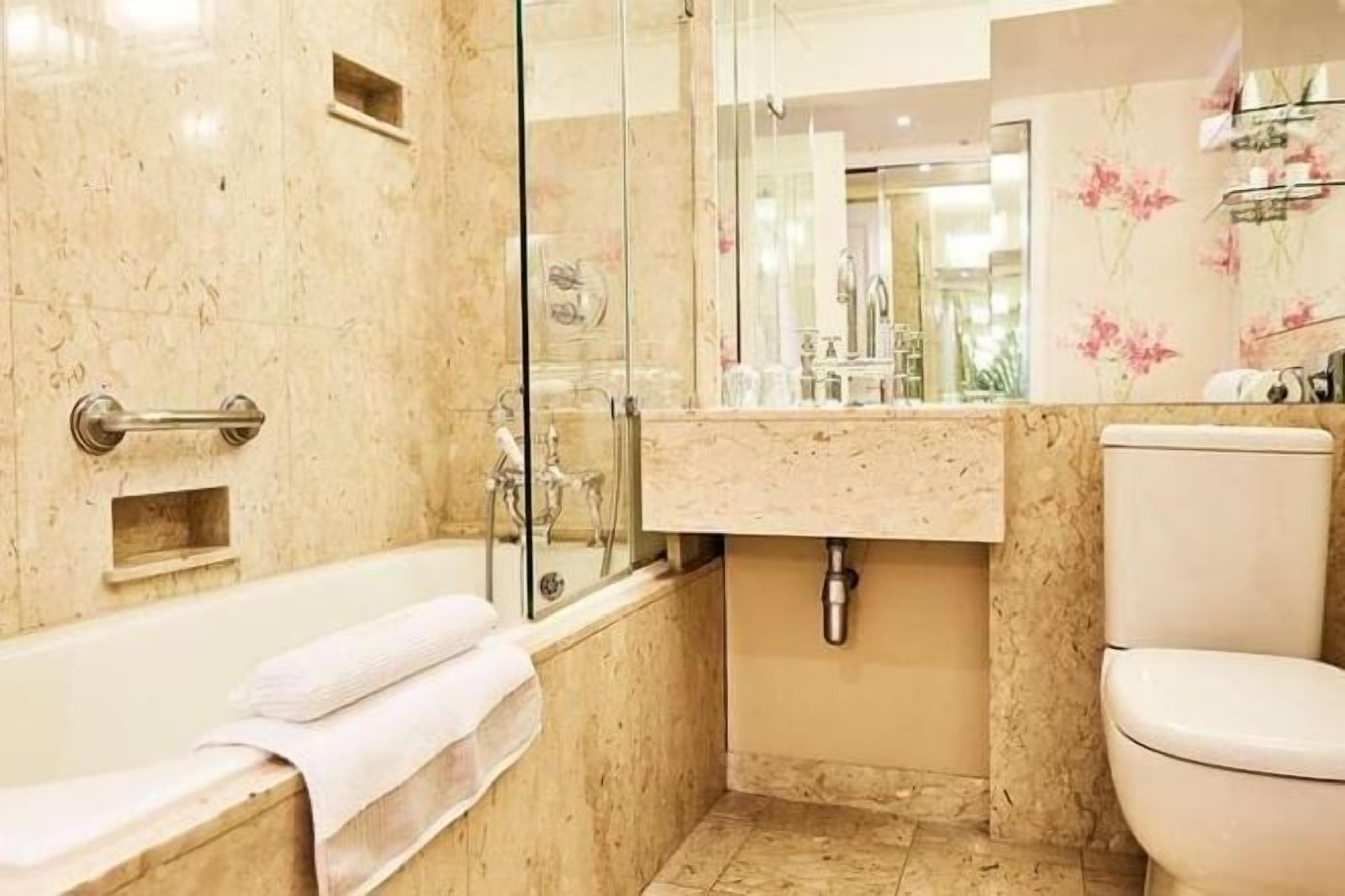 Bathroom | Designer toiletries, hair dryer, bathrobes, slippers