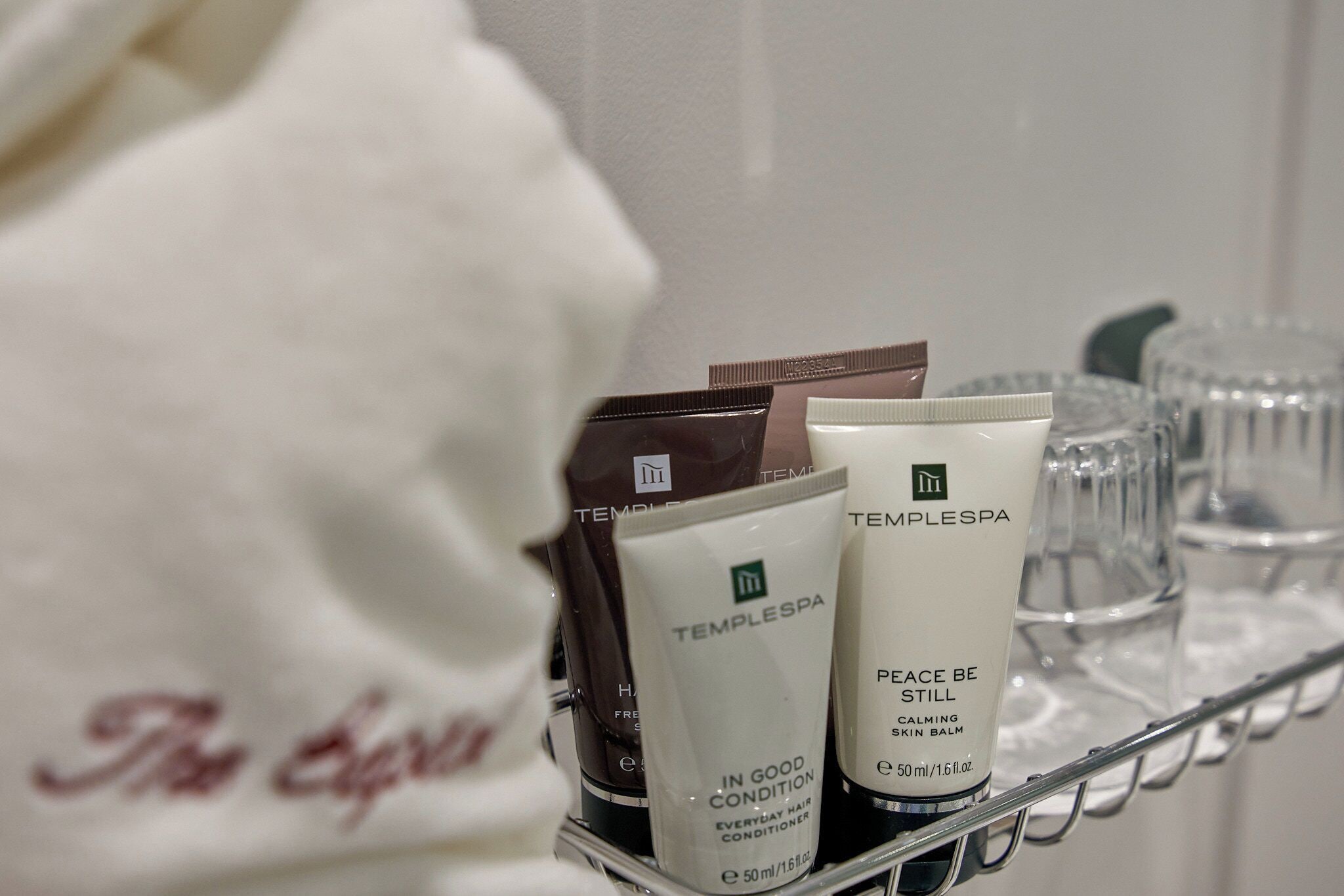 combined shower/bathtub, designer toiletries, hair dryer, bathrobes