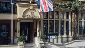 A building with a prominent entrance, a flag, and a sign that reads "The Restaurant at The Capital." - The Capital Hotel, Apartments & Townhouse - Small Luxury Hotels of The World (London)