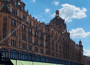 A large, historic building with ornate architecture, multiple windows, and a prominent clock tower. - The Capital Hotel, Apartments & Townhouse - Small Luxury Hotels of The World (London)