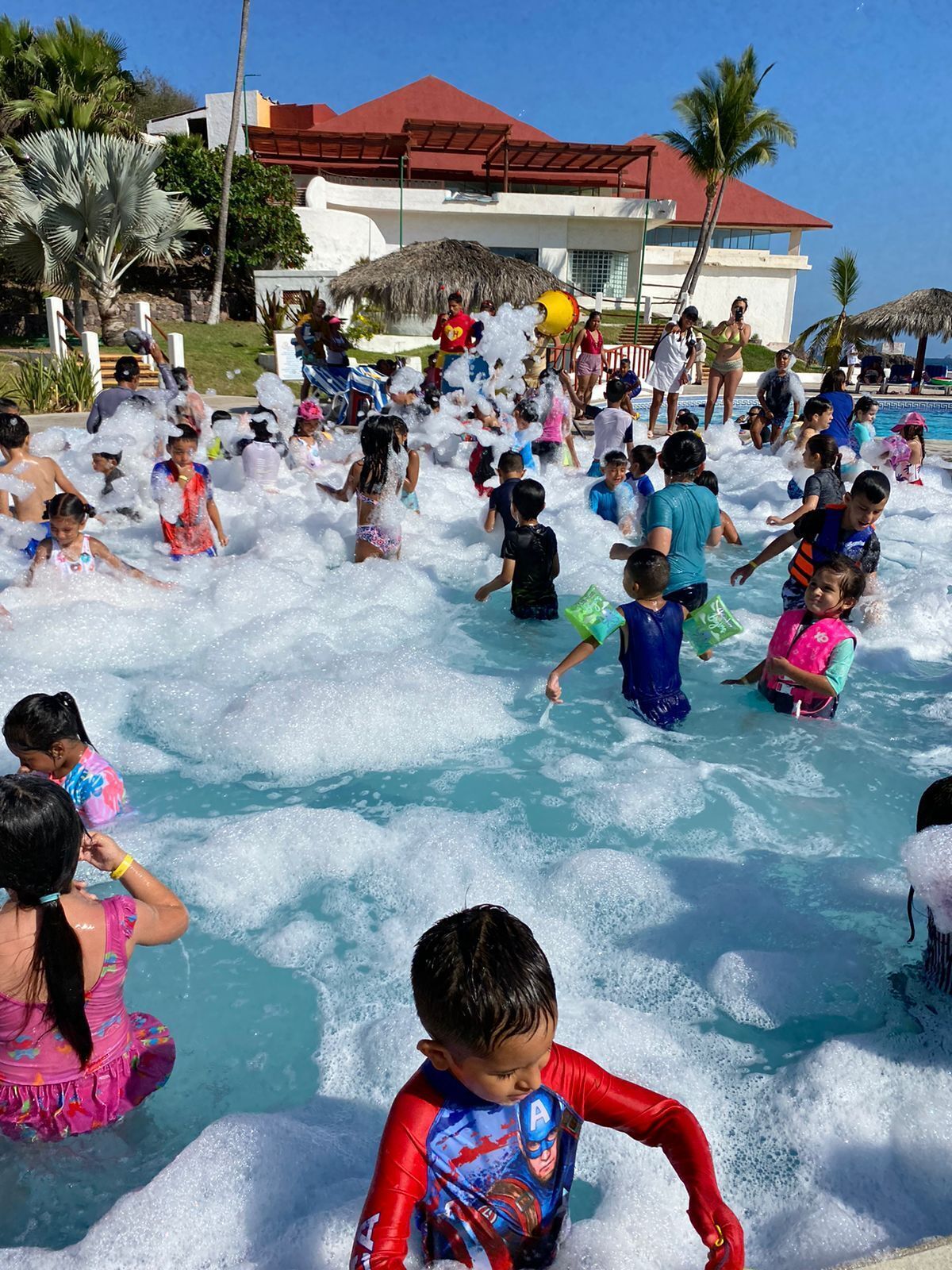 Outdoor pool, open 9:00 AM to 7:00 PM, pool umbrellas